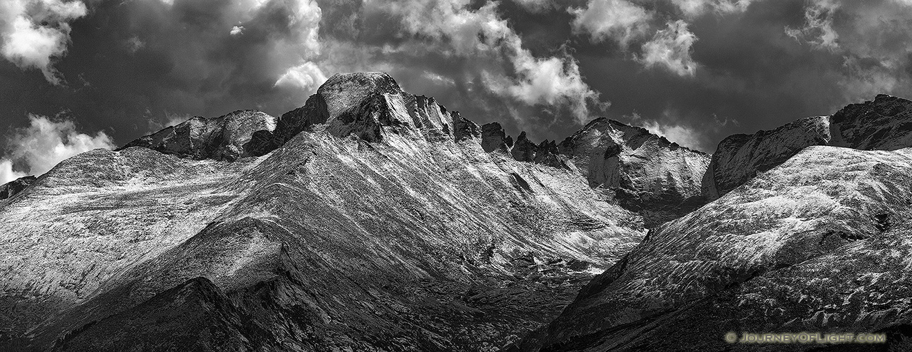 After a fresh covering of snow, Long's Peak emerges from the clouds after a storm over Rocky Mountain National Park. - Rocky Mountain National Park Picture