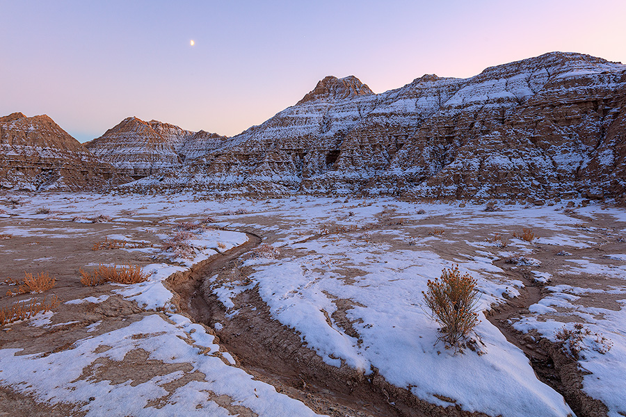 Scenic landscape photograph of a moonrise at Toadstool Geologic Park in western Nebraska after snow. - Nebraska Photography