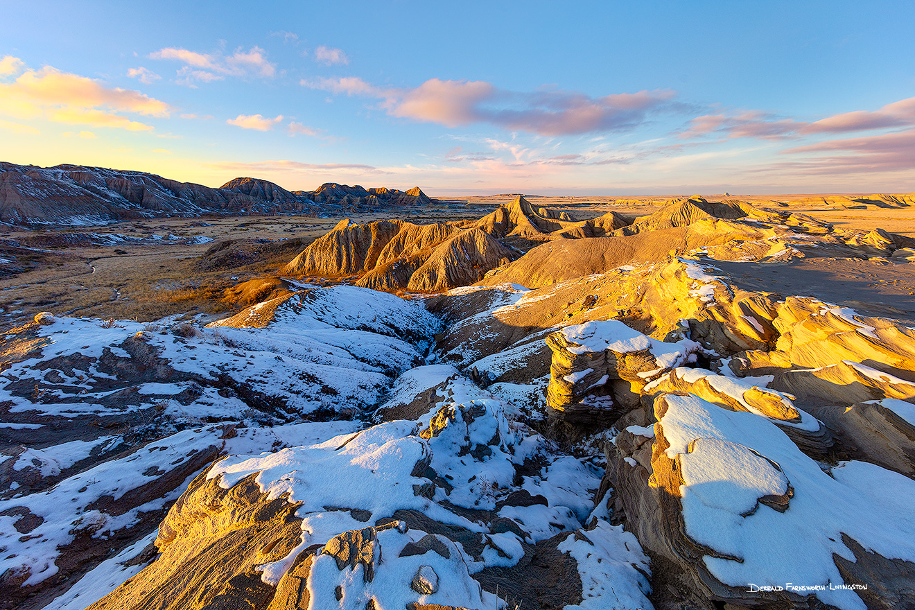 Scenic landscape photograph of sunset at Toadstool Geologic Park in western Nebraska after snow. - Nebraska Picture