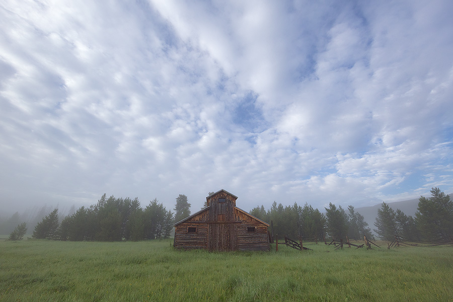 Fog engulfs the Kawuneeche Valley creating an eerie quiet near this old rustic barn in Rocky Mountain National Park. - Colorado Photography