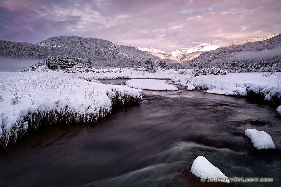 On a cold day in mid-May, the Big Thompson flows through Moraine Park as the first sunlight of the day illuminates the peaks of the Continential Divide. - Rocky Mountain NP Photography