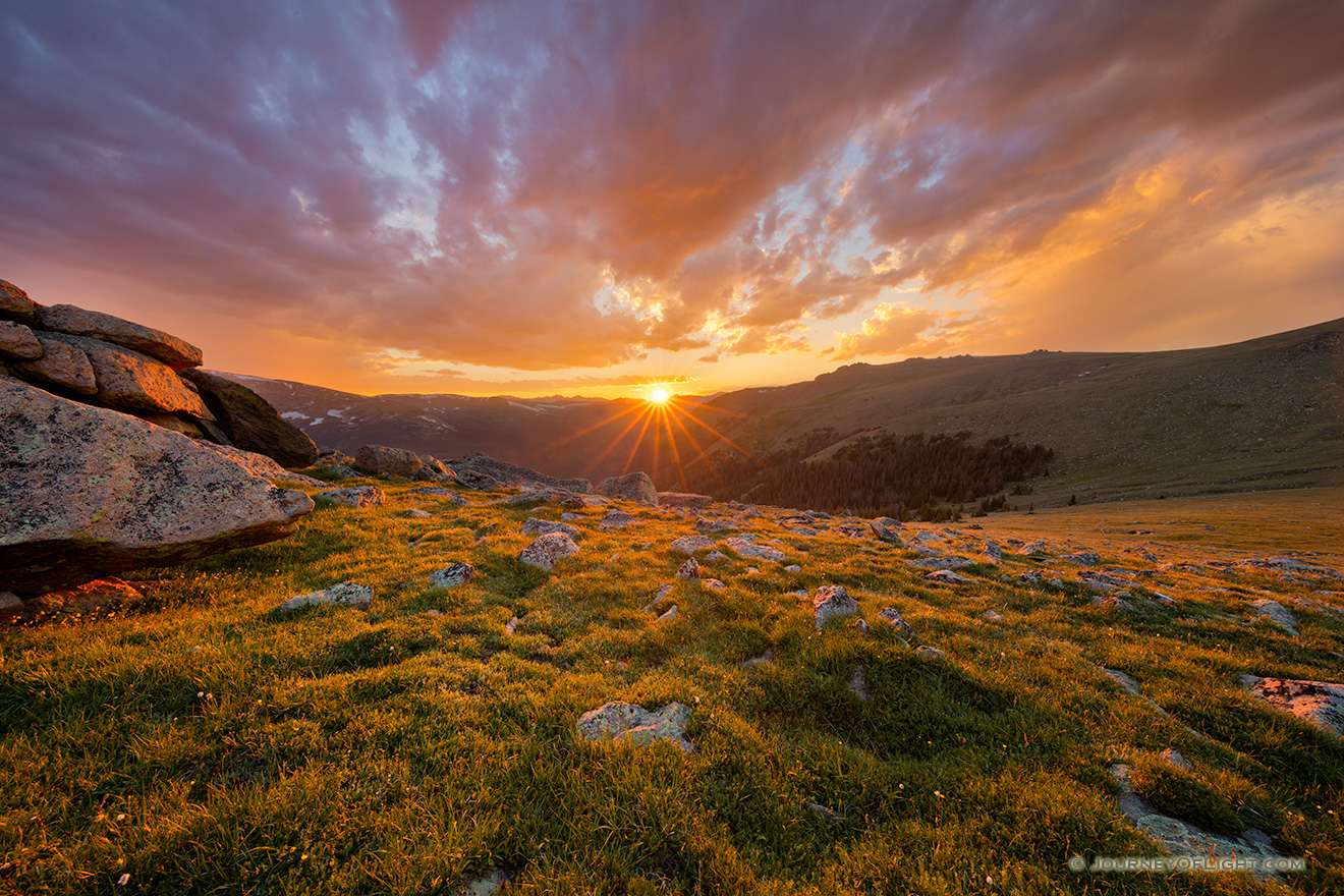 The setting sun shines for the last few seconds as it sets behind the Never Summer Range at Rocky Mountain National Park. - Rocky Mountain NP Picture