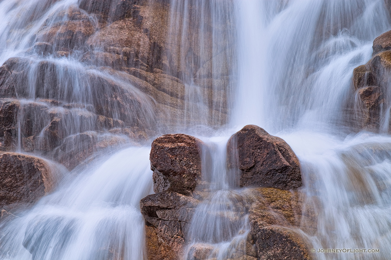 In the spring, the water flows down from Lawn Lake to the Alluvial Fan in a greater volume than the rest of the year, cascading over the rocks. - Rocky Mountain NP Picture