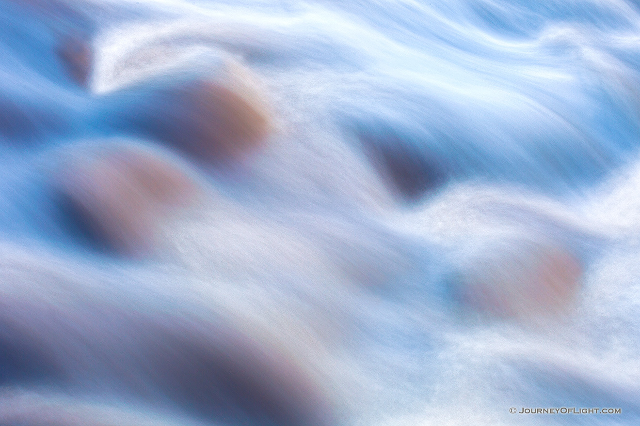 Swollen from several inches of rain, the full and fast Big Thompson River flows through Rocky Mountain National Park. - Colorado Picture