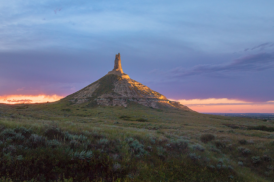 A scenic landscape Nebraska photograph of Chimney Rock illuminated at night. - Nebraska Photography