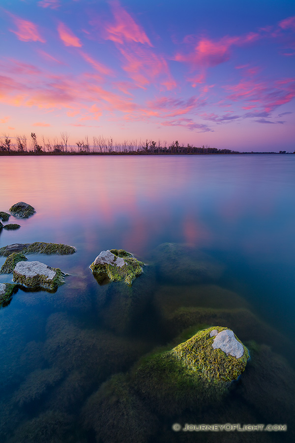 Quiet.  Peaceful.  The day ends with pink clouds and a purplish sky in the distance.  All is quiet save for the rustling of the nearby cottonwoods from a gentle easterly breeze.  This is my favorite time of the day, the time when shadows grow long and colors vivid. - DeSoto Photography