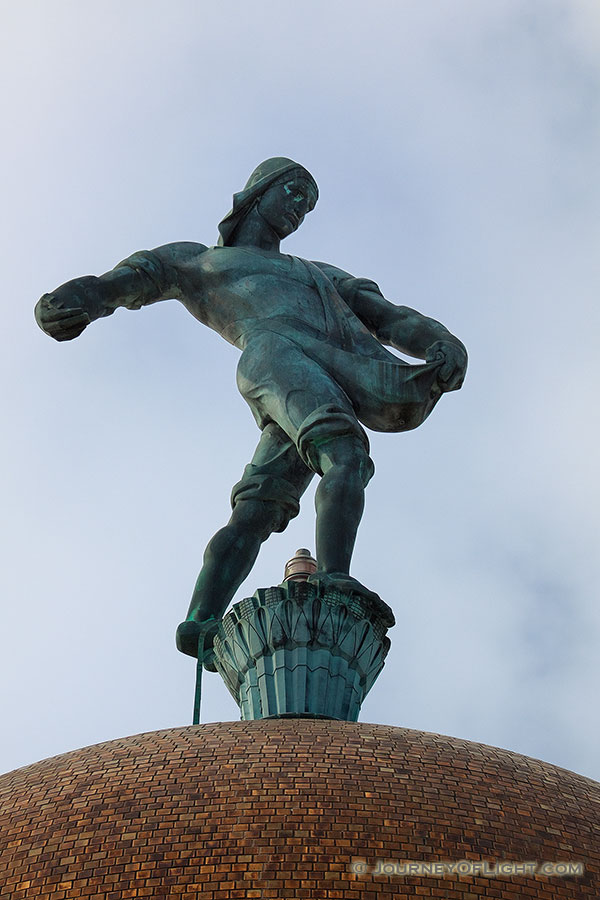 The Nebraska state capitol building in Lincoln sports a statue of a sower on very top of the building entitled simply, 