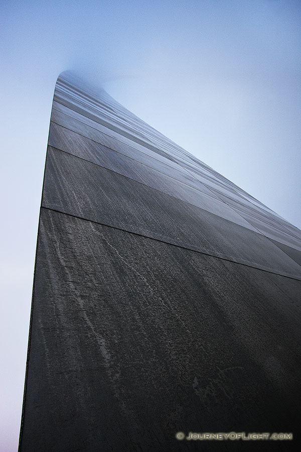 Into the fog the Gateway Arch in St. Louis dissappears.  - Jefferson National Expansion Memorial Photography