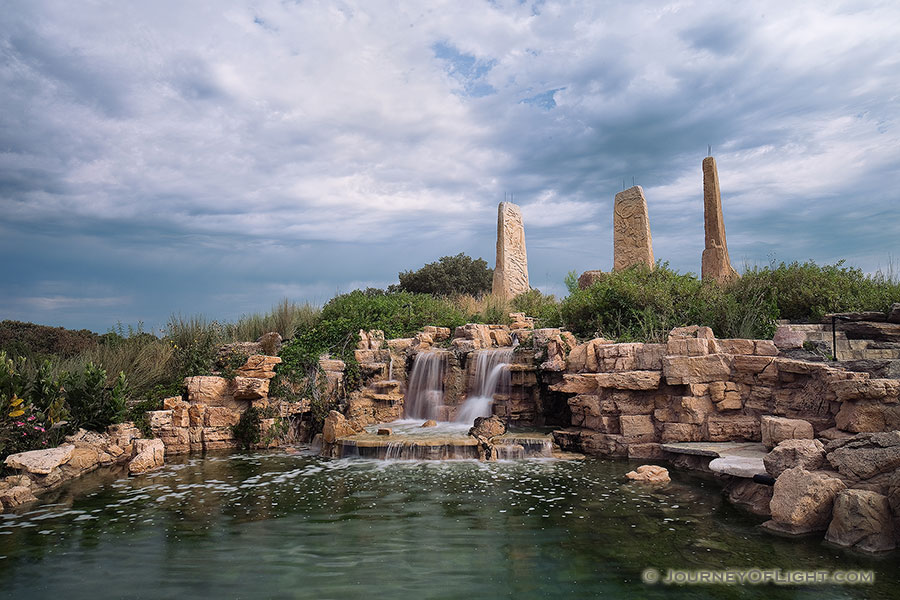 Ponca State Park in northeastern Nebraska features the 'Towers of Time' monument, created by Jay Tschetter and it represents various eras in Earth's past:
				<p>The 25-foot tower on the left depicts the late Cretaceous Period (65 million to 99 million years ago) when Nebraska was under water. This was the age of the dinosaurs and displays prehistoric sea and land creatures.
				<p>The 27-foot center tower features species from the Pleistocene Period (1.8 million to 10,000 years ago). This was during the Ice Age when woolly mammoths, saber-toothed cats and giant sloths roamed the Earth.
				<p>The 25-foot tower on the right features a collection of modern animals, everything from blue herons to buffalo that inhabit the Missouri River region.
				<p>The square fountain includes images of indigenous people from the Folsom culture, Paleolithic period, Earth Mound Builders and recent Natives who occupied the region in the 1800s.
			 - Ponca SP Photography