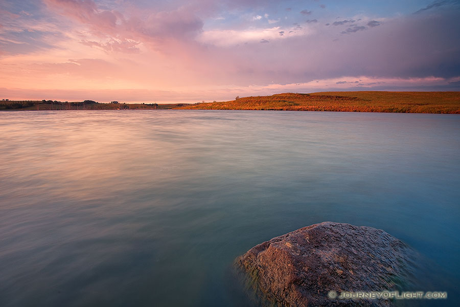 Just after sunrise on a summer's morning, warm light illuminates Powder Creek Wildlife Management Area in northwestern Nebraska. - Nebraska Photography