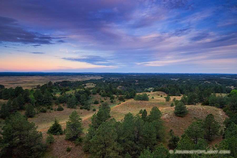 Clouds roll over Halsey National Forest in the central Nebraska.  From the Scott Tower lookout the largest handplanted forest in the United States extends into the distance. - Sandhills Photography