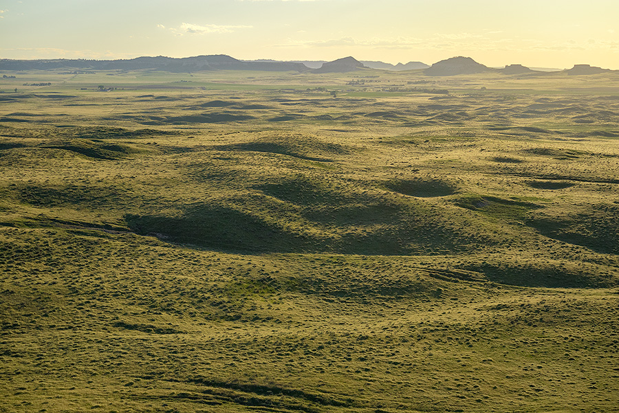 To the west of Chimney Rock the sky glows warm with the light of the setting sun. - Nebraska Photography