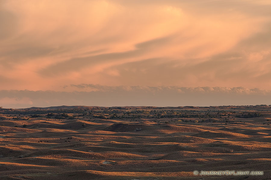 Thunderheads hover over the Sandhills during sunset while Buffalo graze on the grass in Brown County in north central Nebraska. - Nebraska Photography