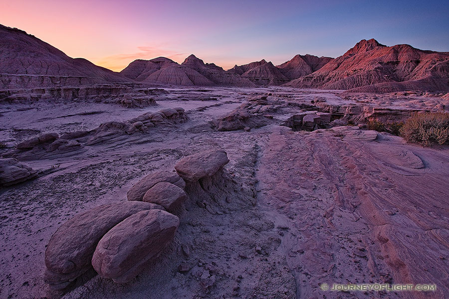 Sunrise begins to illuminate the erie formations at Toadstool Geologic Park in western Nebraska. - Toadstool Photography