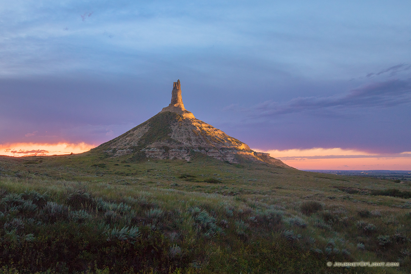 A scenic landscape Nebraska photograph of Chimney Rock illuminated at night. - Nebraska Picture