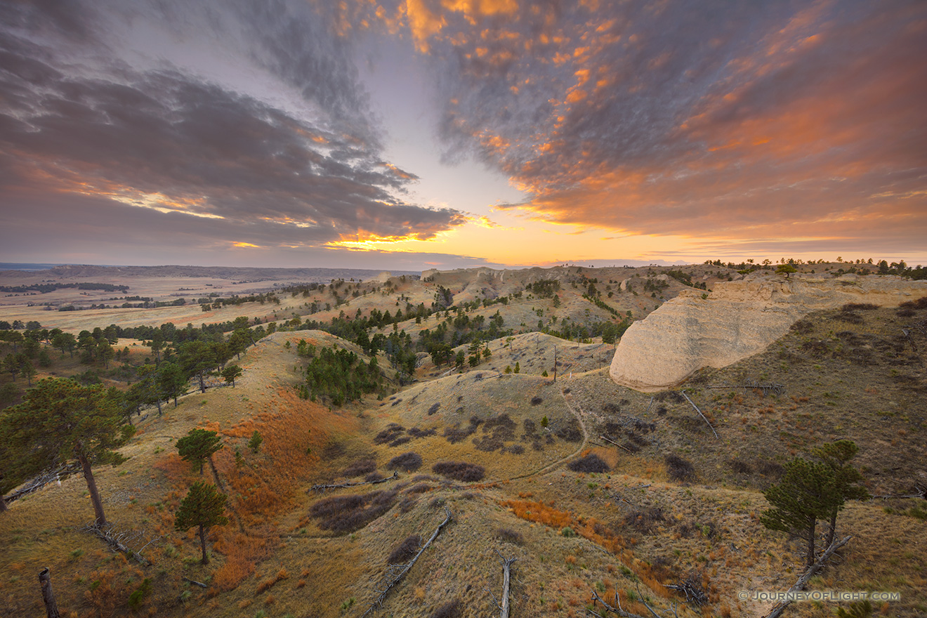 A scenic landscape photograph of a beautiful sunset over Fort Robinson State Park in Northwestern Nebraska. - Nebraska Picture