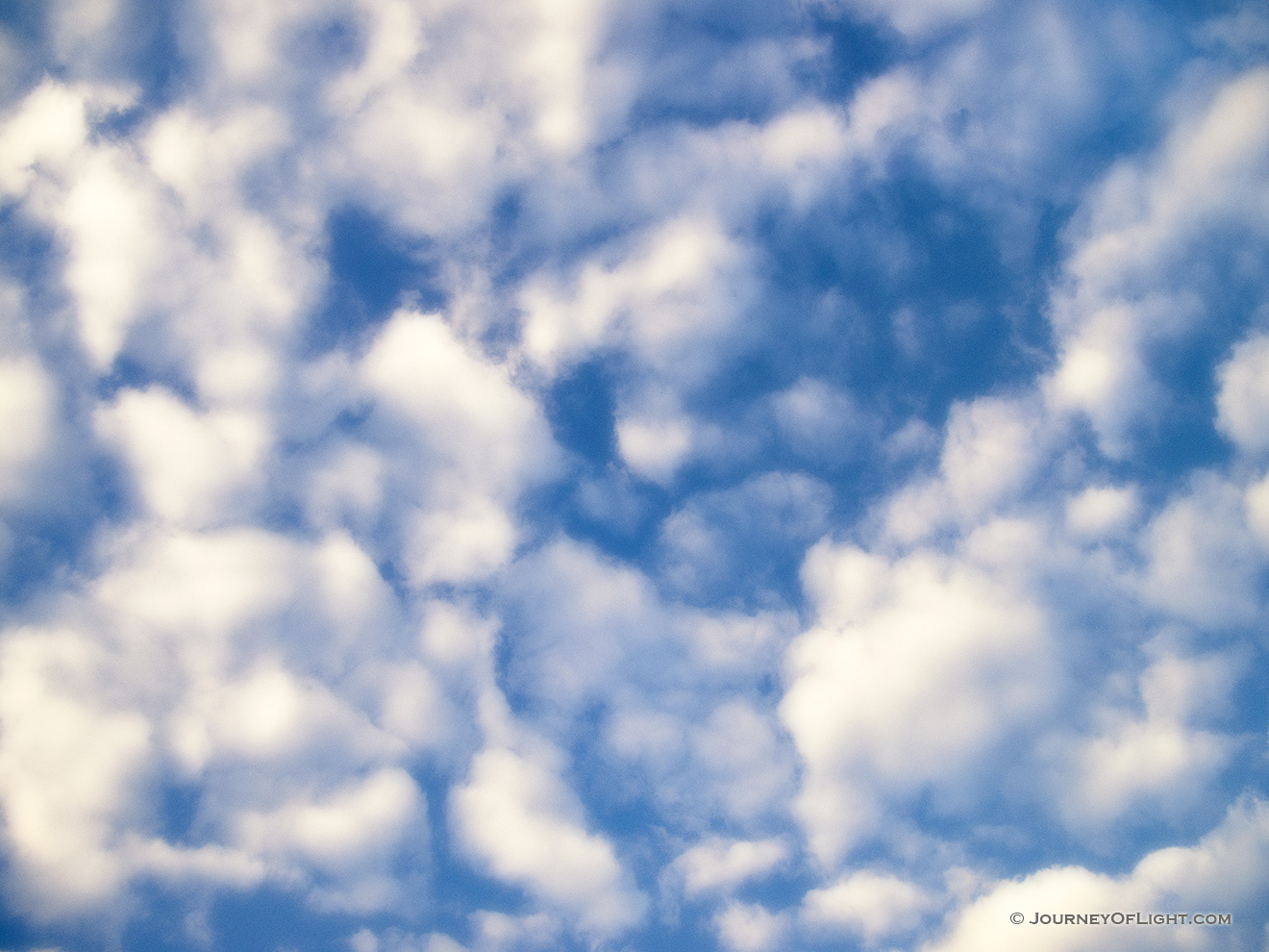 As a child I would lie on my back and watch the clouds lazily float by.  An image reminiscent of those days. - Nebraska Picture