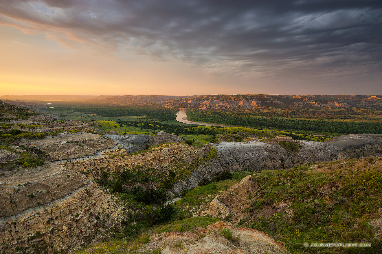 Sunlight streams across the Little Missouri valley in the North Unit of Theodore Roosevelt National Park, North Dakota. - North Dakota Picture