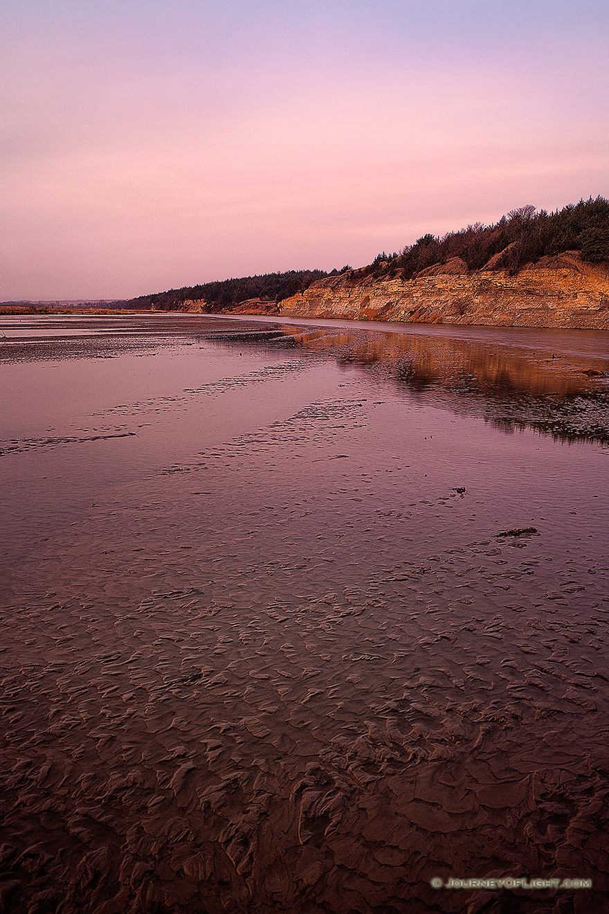 The Niobrara, on a quiet November morning flows quietly into the Missouri shaping and reshaping the landscape slowly.  Although the water from this river is done with this part of its travels, it still has a long journey before reaching the Gulf of Mexico hundreds of miles away. - Nebraska Picture