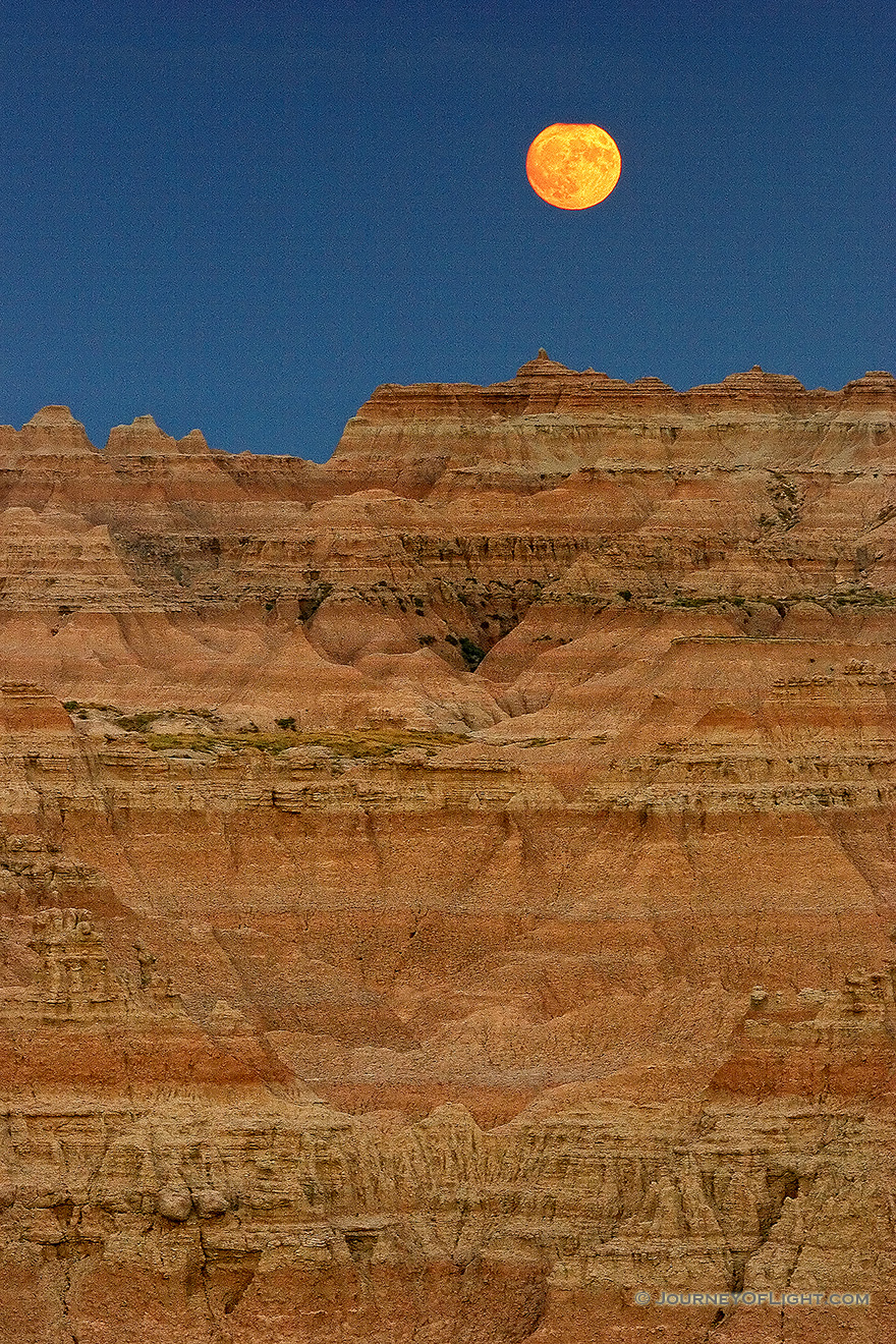 The full moon rises above the Badlands. - Badlands NP Picture