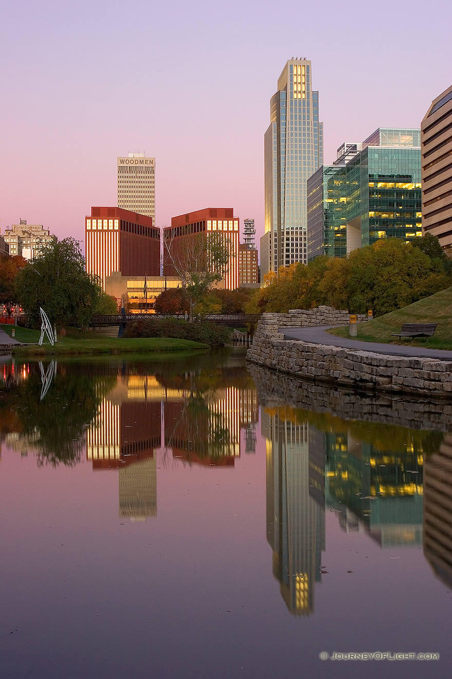 Downtown Omaha, Nebraska on the Gene Leahy Mall in the Early Morning just before sunrise.  The two larger skyscrapers, the Woodman Tower and the First National Bank building dominate the skyline. - Omaha Picture