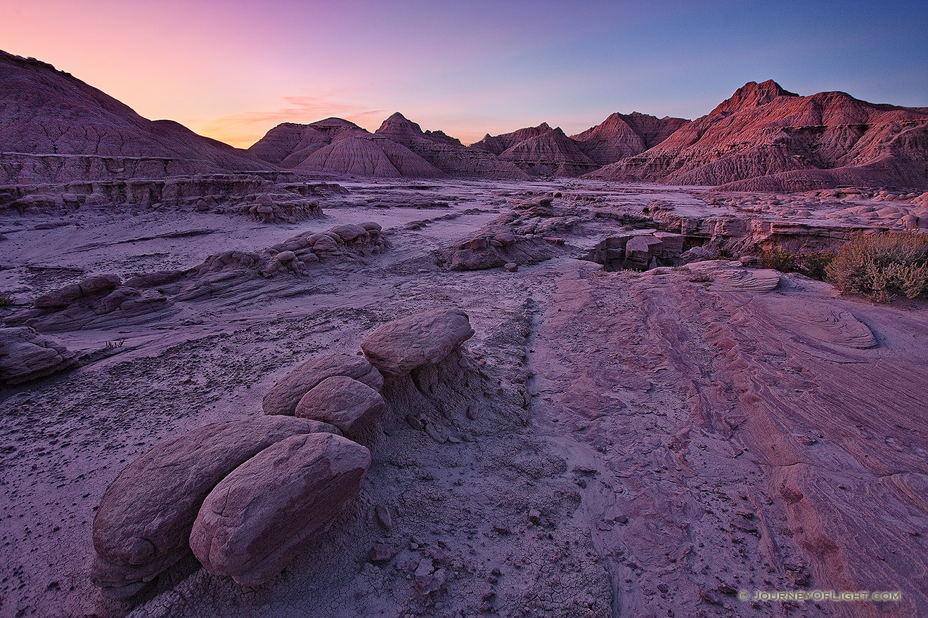 Sunrise begins to illuminate the erie formations at Toadstool Geologic Park in western Nebraska. - Toadstool Picture