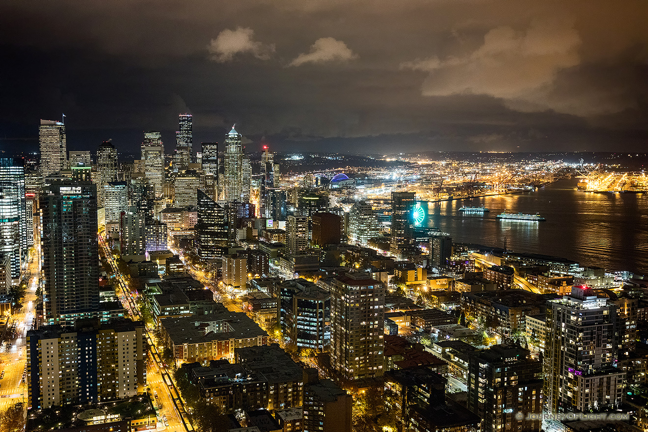 The city of Seattle stretches out into the distance from the vantage of the Space Needle. - Pacific Northwest Picture